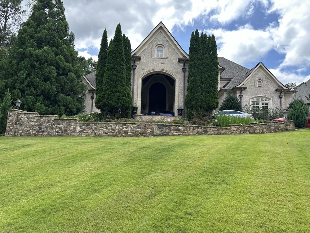 Well-maintained property with manicured green lawn in West Georgia